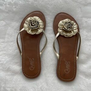 Gold flower flip flops